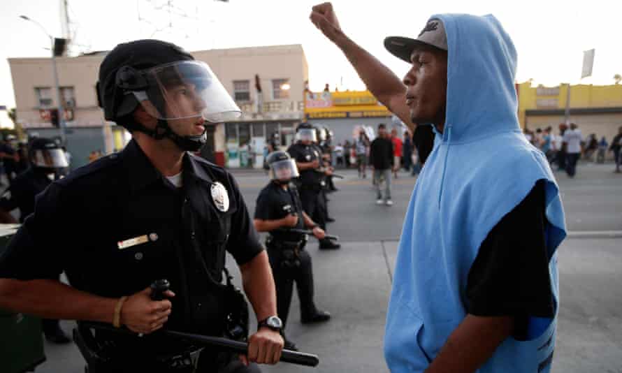 A protester confronts the police after the acquittal of Trayvon Martin's killer in 2013.