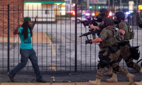 A man is arrested during protests over the death of Michael Brown, an unarmed black teenager killed by a police officer, in Ferguson, in August 2014.