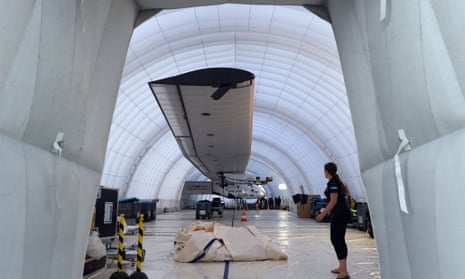 An inflatable hangar covers Solar Impulse after it was damaged by wind as it sat on the tarmac in Japan.