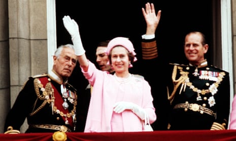 Earl Mountbatten of Burma, the Queen and the Duke of Edinburgh wave from the balcony of Buckingham Palace after the silver jubilee procession.