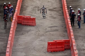 The semi-autonomous Escher (Electromechanical Series Compliant Humanoid for Emergency Response) robot, from team Valor of Virginia Tech, walks through the competition’s slalom section.
