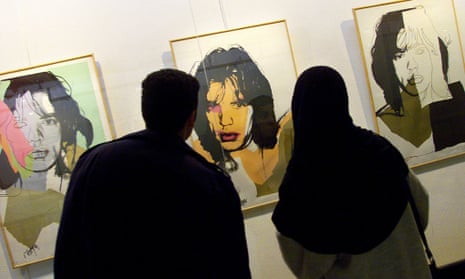 Iranians look at Andy Wharhol's portraits of rock star Mick Jagger during an exhibition of Pop Art at the Museum of Contemporary Art in Tehran, Iran.