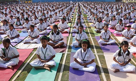 Indian schoolchildren practise yoga at Delhi Public School in Hyderabad.
