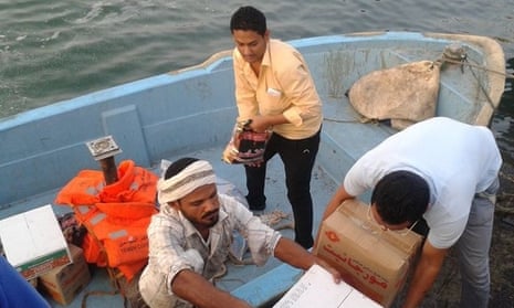 A boat transports medical supplies for the International Medical Corps in Yemen