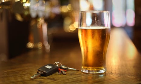 car keys next to a pint of beer