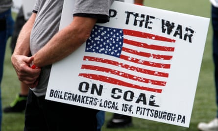 A member of the Boilermakers local 154 Pittsburgh holds a sign at a rally to support American energy and jobs in the coal and related industries at Highmark Stadium in downtown Pittsburgh, Wednesday, July 30, 2014. The rally is being held the day before the Environmental Protection Agency conducts public hearings on its new emissions regulations for existing coal fired power plants.
