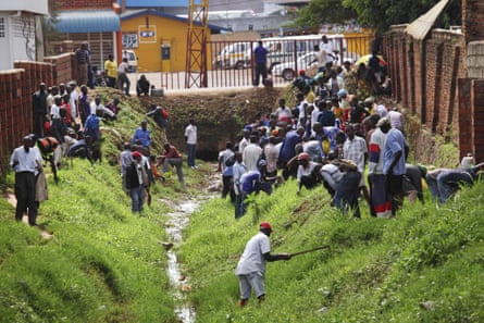 People participate in the monthly clean-up day, Umuganda, in Kigali.