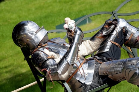 How are you going to eat that? A knight at Warwick Castle attempts eating an ice cream