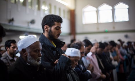 Men attend the first Friday prayers of the Islamic holy month of Ramadan at the East London Mosque on June 19.