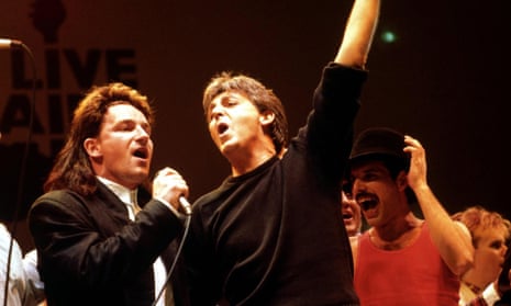 (L to R) Bono of U2, Paul McCartney, and Freddie Mercury perform in the finale of the Live Aid concert at Wembley stadium in 1985.