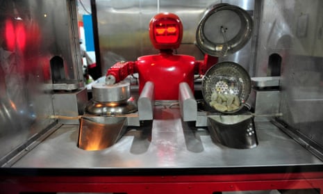 A robot that specialises in cooking, prepares jiaozi, or Chinese dumplings, at a Robot Restaurant in Harbin, Heilongjiang, China