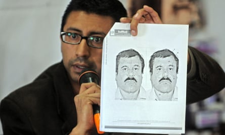 Wanted: the Guatemalan migration director shows a picture of Guzman during a press conference in Guatemala City