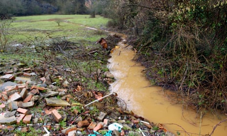 A discoloured stream running out of Brofiscin Quarry in south Wales. Toxic waste was dumped here in 1970s by contractors working for Monsanto.