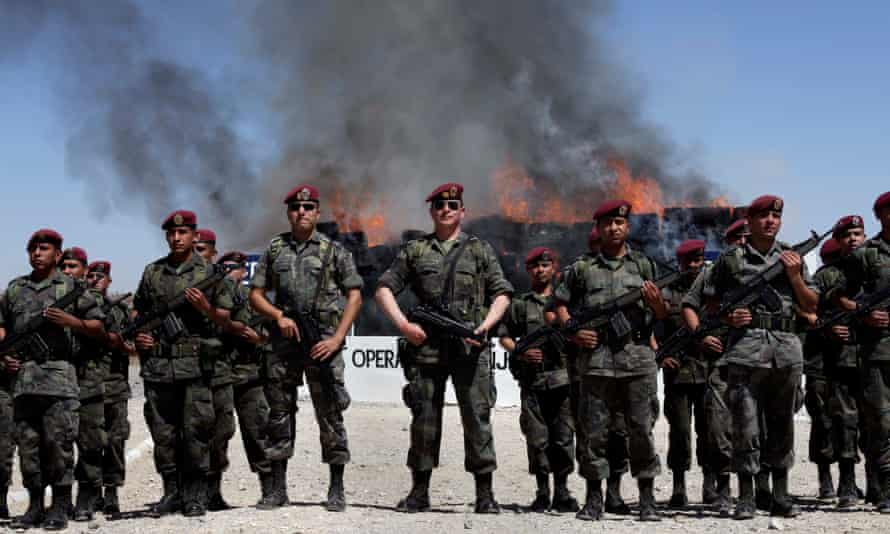 Soldiers stand guard as drugs are destroyed in Ciudad Juarez, Mexico.