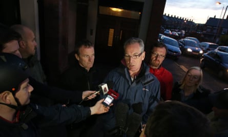 Sinn Fein's Gerry Kelly speaks the media after a number of police officers have been injured after loyalists rioted in Belfast when a contentious Orange Order parade was halted.