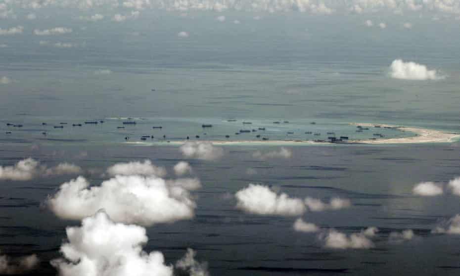 An aerial file photo taken though a glass window of a Philippine military plane shows the alleged on-going land reclamation by China on Mischief Reef in the Spratly Islands in the South China Sea, west of Palawan, Philippines, May 11, 2015