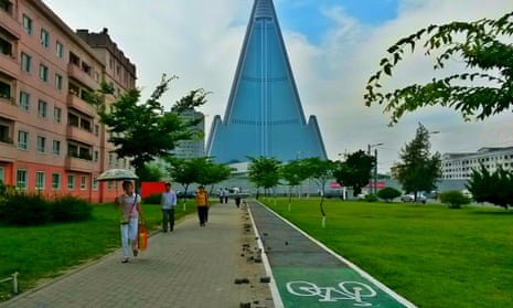 A cycle path in central Pyongyang, with the 105-storey Ryugyong Hotel in the background. Bicycle ownership has risen in the country in recent years. 