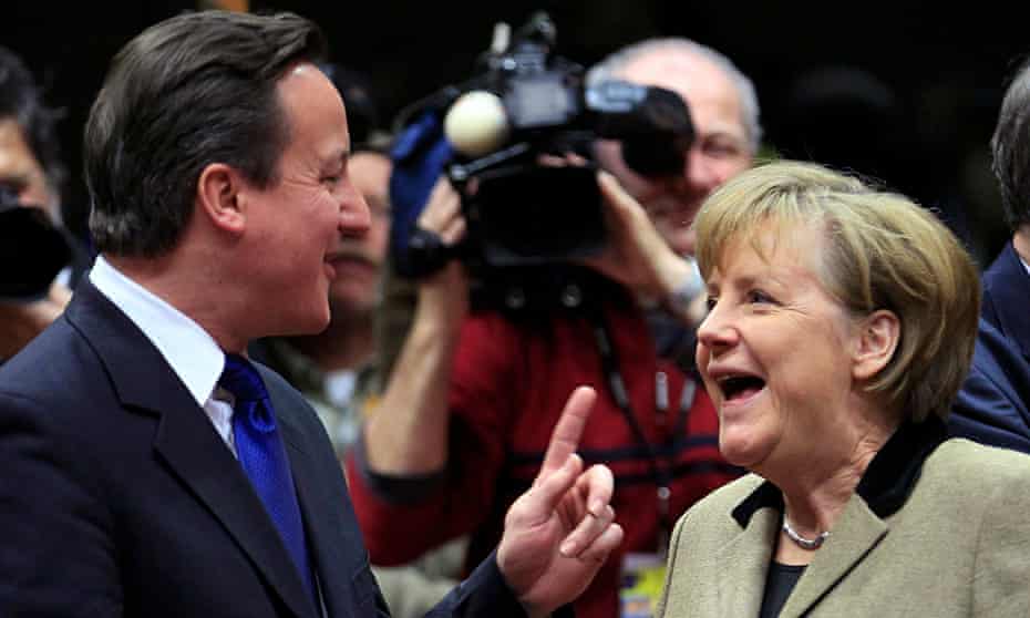David Cameron talks with Germany's chancellor Angela Merkel