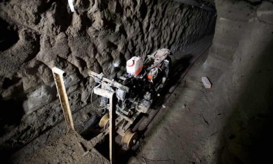 El Chapo's rail-running escape motorcycle sits in the tunnel under the half-built house where authorities say he made it to freedom.