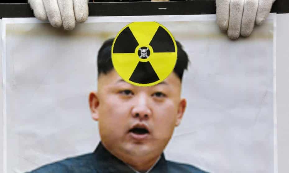 A South Korean protester holds a picture of Kim Jong-un during a rally following a nuclear test conducted by North Korea in February 2013.