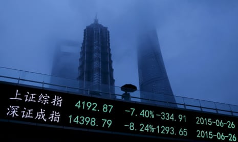 An electronic board shows the plunging Shanghai and Shenzhen stock indices, in Shanghai's Pudong financial district.