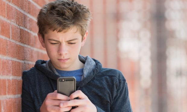 Teenager using smartphone