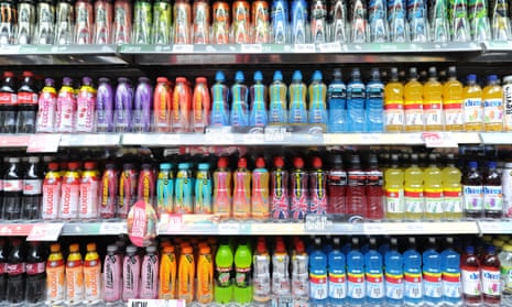 Soft and fizzy drinks on a supermarket shelf.
