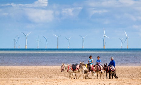 A windfarm off the coast at Skegness. Offshore wind farms are generating more electricity than expected.