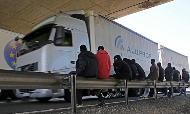 Migrants wait for cross channel lorries
