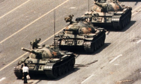 A man stands in front of a convoy of tanks in Tiananmen Square in 1989