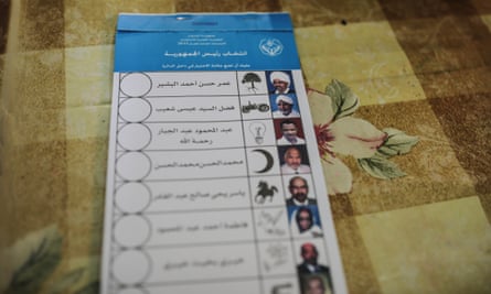 A stack of ballots shows candidates for president including the country's longtime ruler Omar al-Bashir, top, inside a polling station on the first day of Sudan's presidential and legislative elections.
