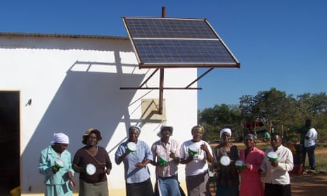 Members of the Gomba Agro-Business Centre showing off their solar lanterns.