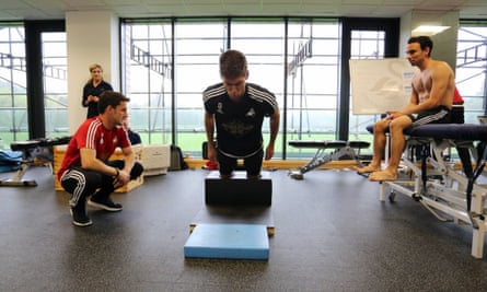 The Swansea defender Federico Fernández takes part in pre-season training on the NordBord, which tests hamstring strength.