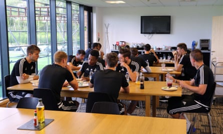 Swansea players have breakfast in the canteen at the training ground.