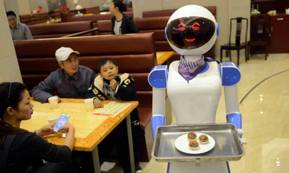 A server robot delivers food at a restaurant in Cixi, east China's Zhejiang Province