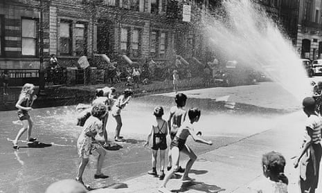 Children escape the heat of the East Side by using fire hydrant as a shower bath in 1943.