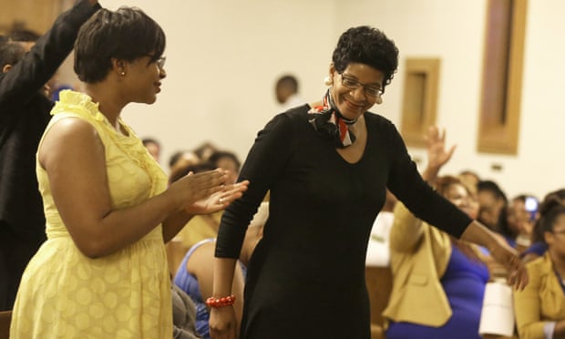 Geneva Read Veal, right, and her daughter Sharon Cooper react to a prayer during a memorial service for Read Veal's other daughter Sandra Bland.