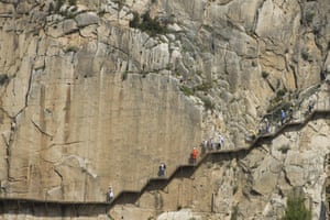 Tourists walk the El Caminito del Rey.