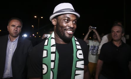 Michael Essien is all smiles at Athens International Airport last month as he arrives to sign for Panathinaikos.