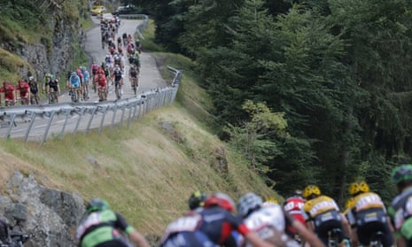 The peloton speeds downhill during stage 18.
