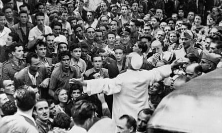 Pope Pius XII in the middle of the crowd, during the bombardment of the basilica Saint Laurent, in Rome, July 1943. Photograph: Photograph: Roger-Viollet/REX Shutterstock