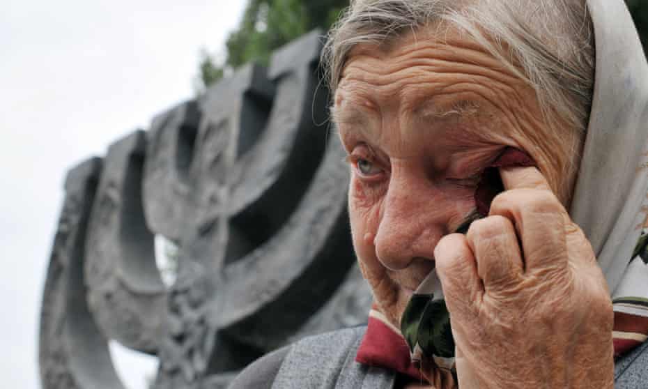 A woman in front of Minora monument in Kiev, during a mourning ceremony marking the 68th anniversary of the beginning of Jews mass execution in September 1941.