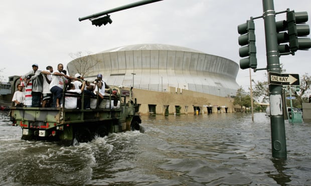 A National Guard truck takes residents through floodwaters to the Superdome.