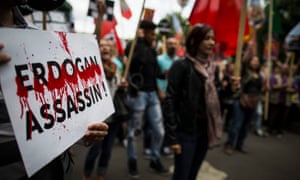 Members of the Kurdish community hold a rally outside the Turkish embassy in Paris to protest against the Turkish air force attacks on the PKK military campaigns in Syria and northern Iraq.