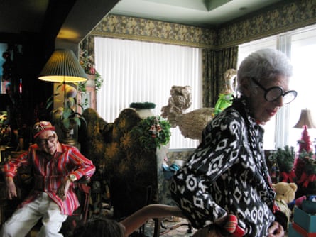 Carl Apfel, left, and Iris Apfel, right, at their home. Kermit and the ostrich are just seen in the background.