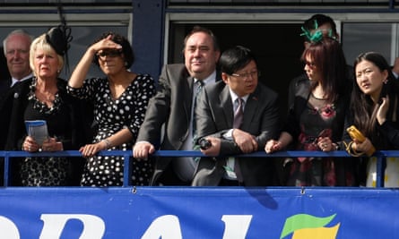 An eye for a winner: Alex Salmond (centre) watches racing at Ayr.