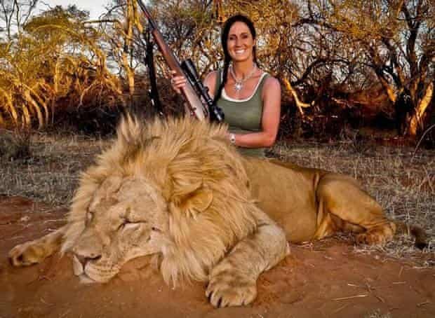 Hunter and TV host Melissa Bachman with a lion she shot.
