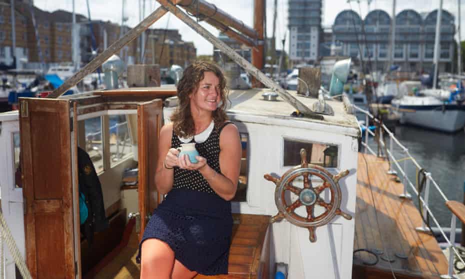 Smillie enjoys a cup of tea on her boat in South dock marina, Deptford.