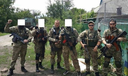 Fighters from the Sheikh Mansur battalion, some with their identity hidden, near the front line at Shirokyne on 30 June.