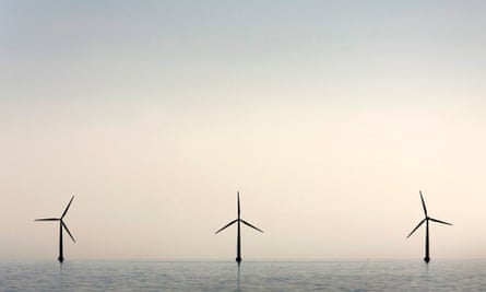 An off-shore wind farm stands in the water near the Danish island of Samso